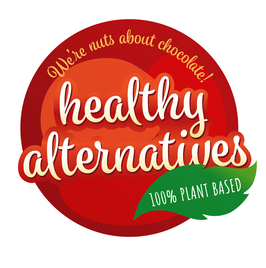 the healthy alternatives logo - a red circle with cursive text that reads "We're nuts about chocolate! One hundred percent plant based"