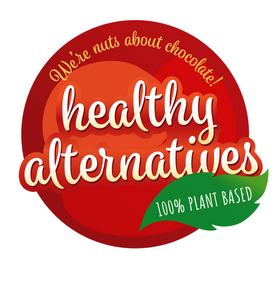 the healthy alternatives logo - a red circle with cursive text that reads 